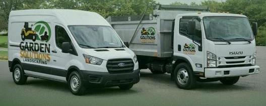 Garden Solutions branded landscaping vehicles